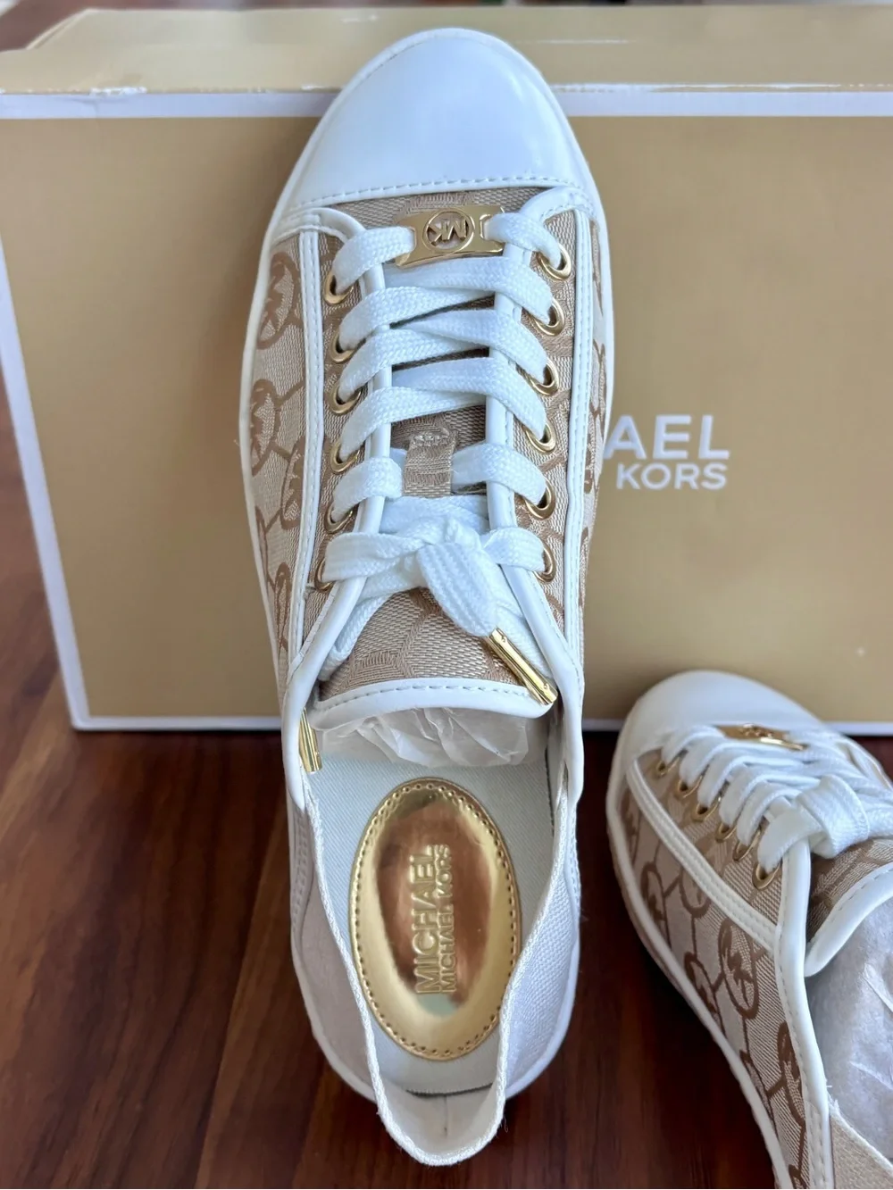 Brand New pair of Michael Kors Kristy Slide Sneakers in a cream and beige, 6.5.
